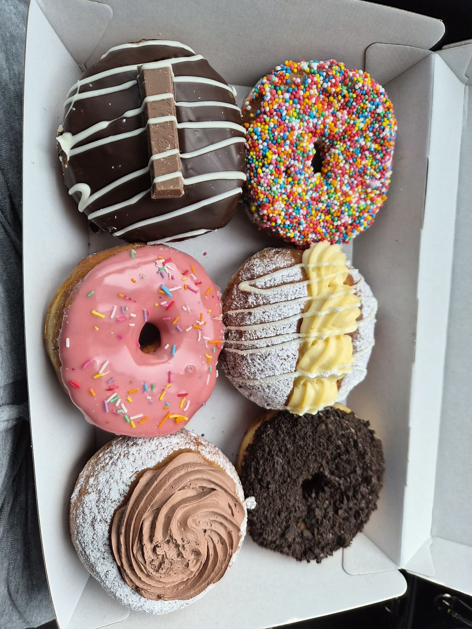 A colourful box of Circle of Life doughnuts